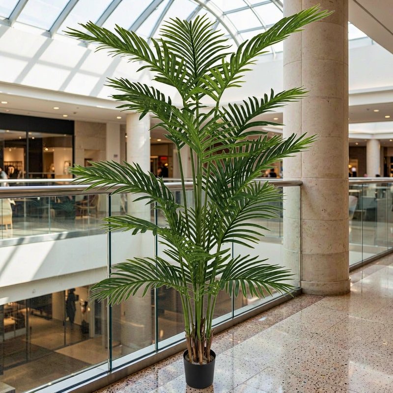 Potted artificial areca palm in a shopping-mall atrium