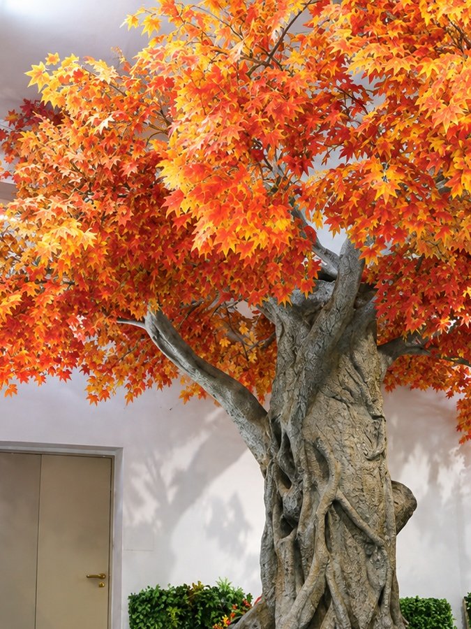Artificial autumn maple tree with orange and red foliage for showrooms and malls