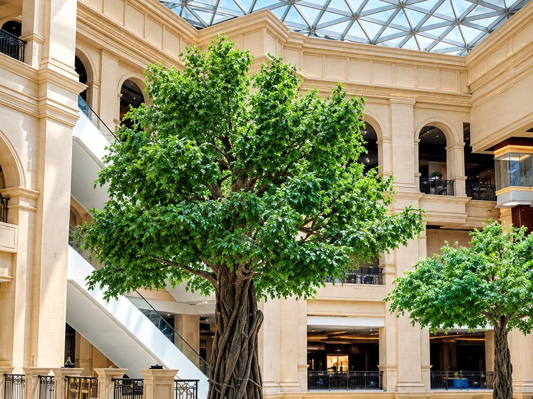 Giant artificial banyan tree under the glass dome of a grand atrium